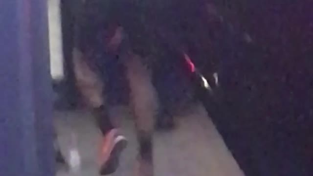 Shirtless guy runs in place at subway station, stops and takes a deep breath