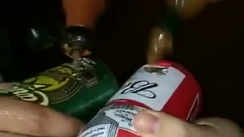 Guys putting hot sauce in beer cans