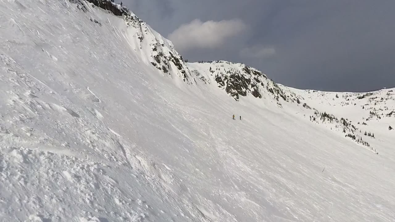 Snowboarder Catches an Edge and Tumbles Down Steep Slope