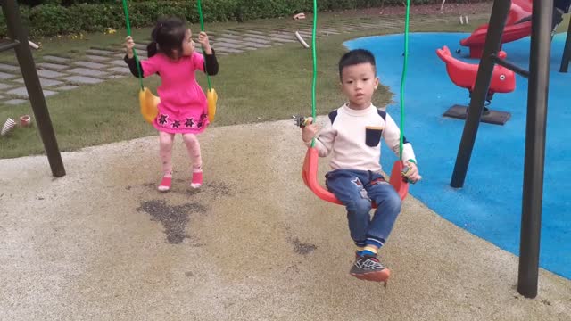 Babies play with a ferris wheel