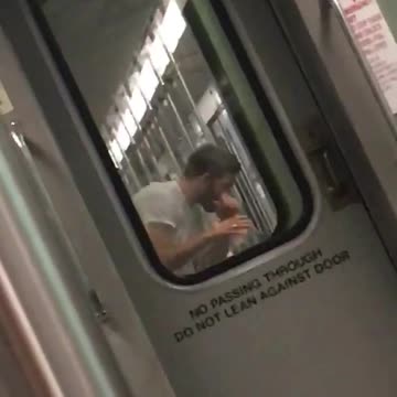 A man in white shirt punching the air