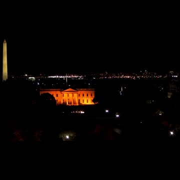 White House is Gold and there is a flashing light in the Monument.