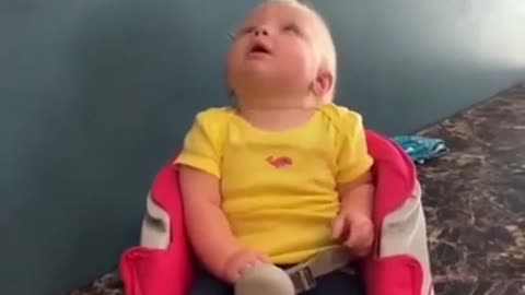 Cute Baby Looking up At Toy