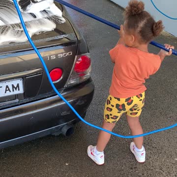 Daughter knows how to wash a car