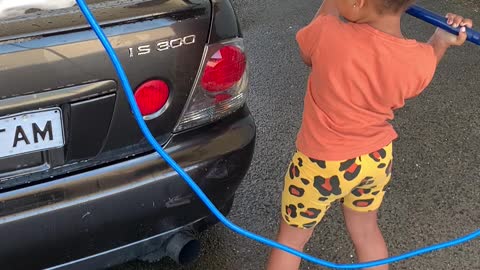 Daughter knows how to wash a car