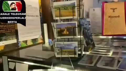 Attivistà no green pass entra nella torre esibendo libretto del partito nazionalsocialista