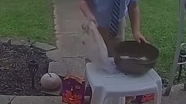 This kid saw the bowl was empty so he shared his candy with the next trick or treaters.