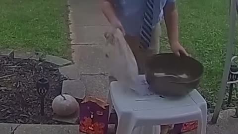 This kid saw the bowl was empty so he shared his candy with the next trick or treaters.