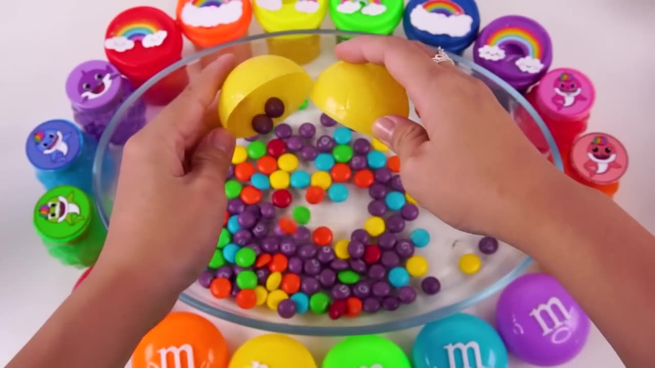 Satisfying vedio mixing rainbow M&M slime candy with baby shark skittles