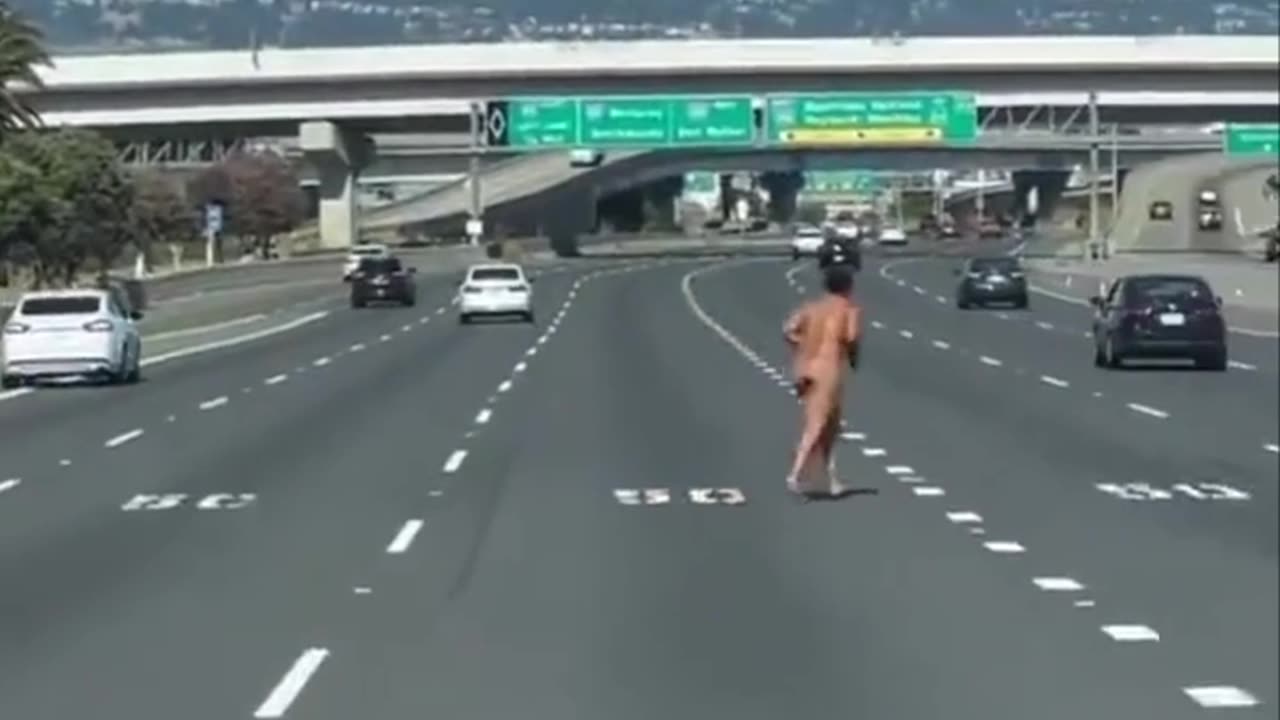 NAKED HOMELESS WOMAN ON SAN FRANCISCO EXPRESSWAY SHOOTING AT TRAFFIC