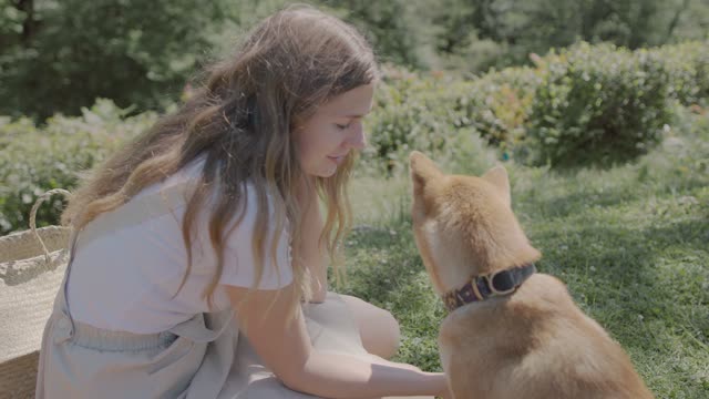 A Woman Petting Her Dog