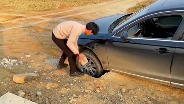 How to get your car out when stuck in a hole
