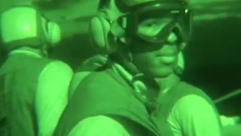 Harrier pilots practice nighttime vertical landings aboard the USS Essex