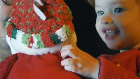 Excited girl with a stuffed Santa Claus