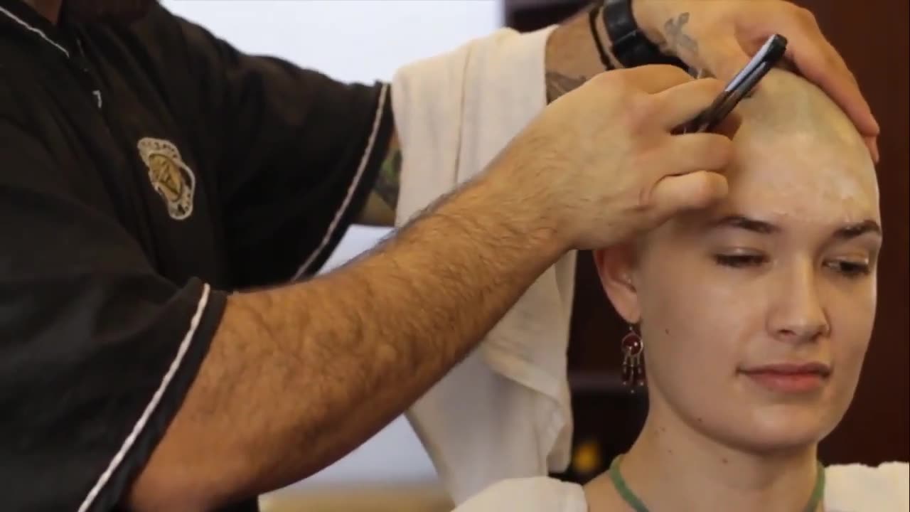 Beautiful woman shaving her hair