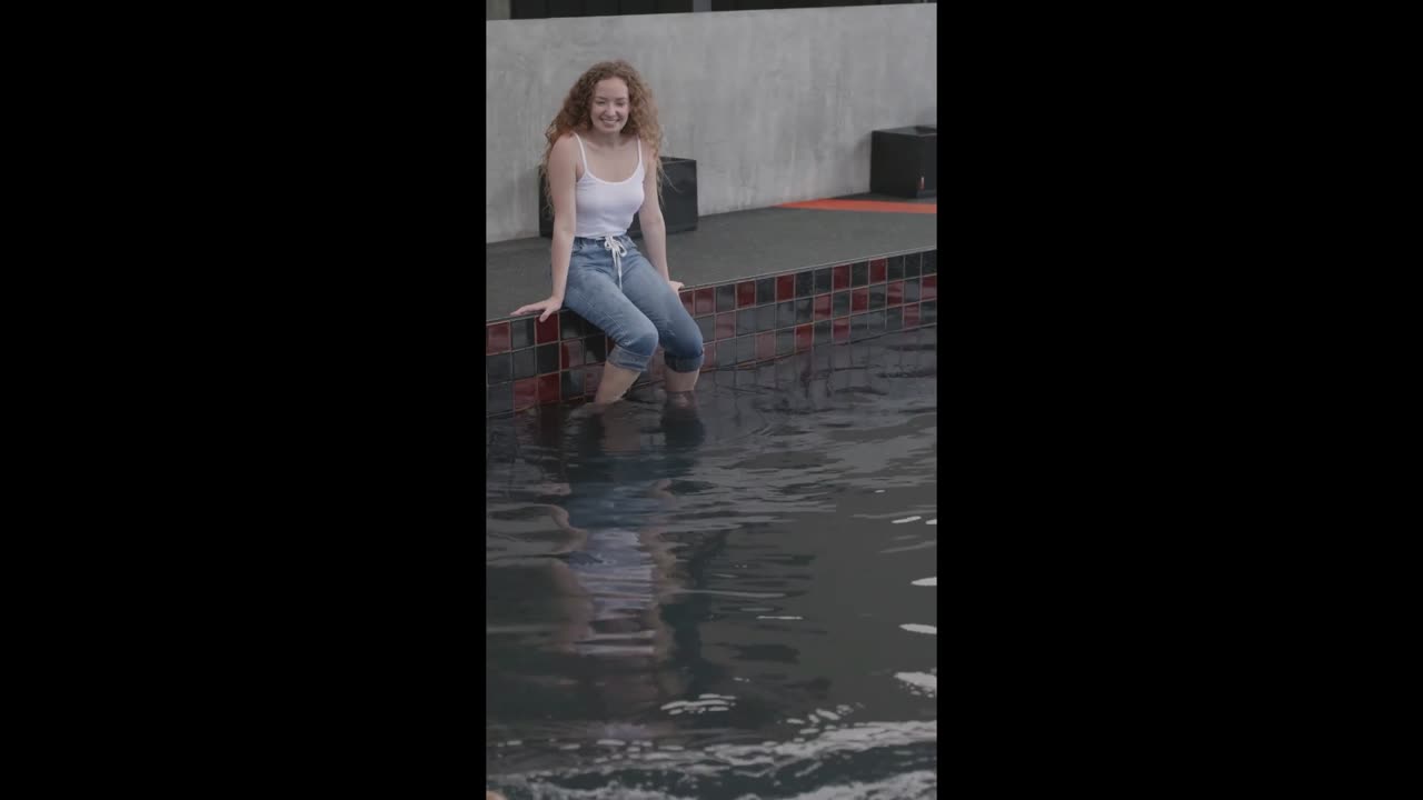 Girl Playing With Dog at Poolside