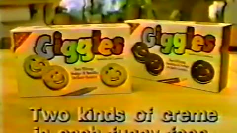 Giggles Cookies - Two kinds of creme in each funny face - Advert