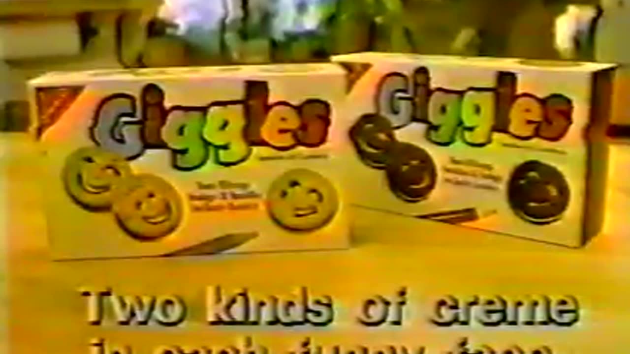 Giggles Cookies - Two kinds of creme in each funny face - Advert