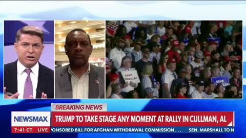 Vernon Jones stands with Trump during rally