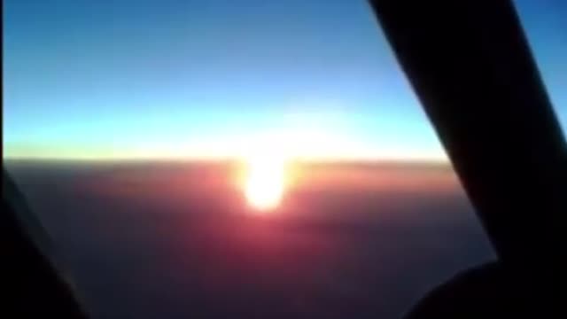Airplane view of the sun and the moon
