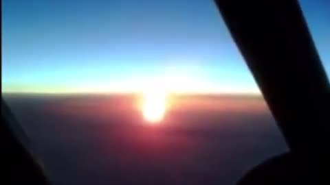 Airplane view of the sun and the moon