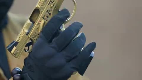 Gold engraved pistol