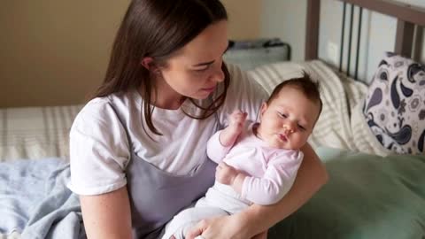 Mother holding her baby in her arms