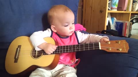 Baby Singing and Playing Ukulele.mp4