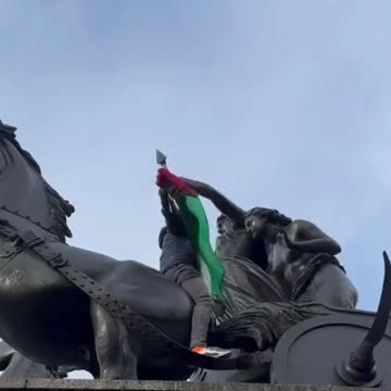 British man removes protester’s flag… “Get your sh*t off my statue”