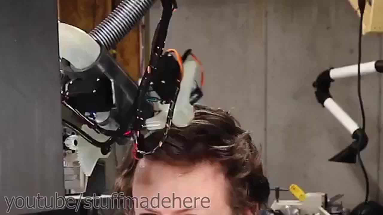 🤖Man gets a haircut from a robot