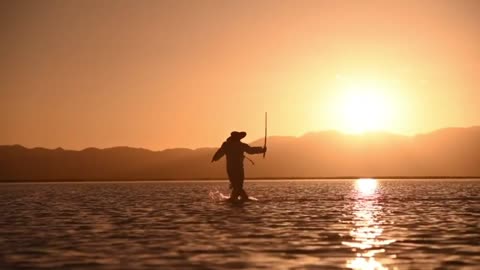 The perfect combination of Chinese swordplay and lake water at sunset.