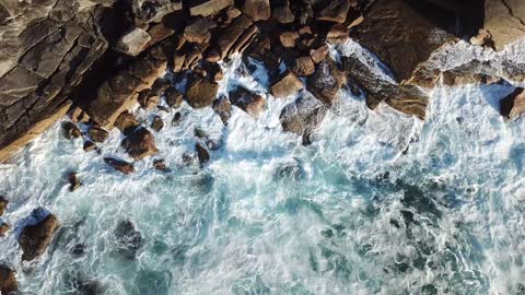 Ocean waves hit the rocks