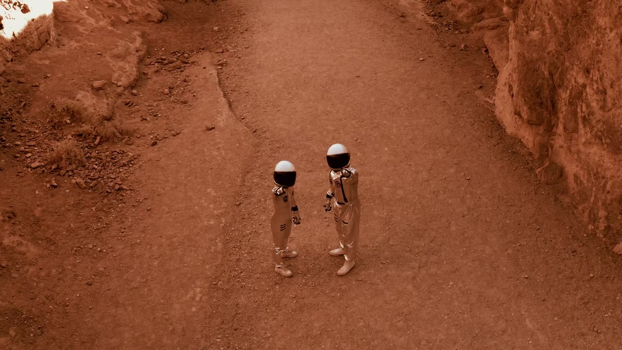 Astrronaut pointing at a drone