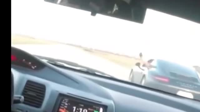 Porsche driver gives a point by. But speeds off instead 🤣