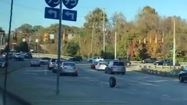 Loose Tire Rolls Down the Street and Hits Another Car