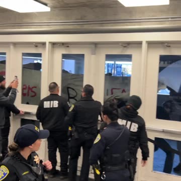 Antifa smashing doors and windows at UC Davis entrance where Charlie Kirk is speaking