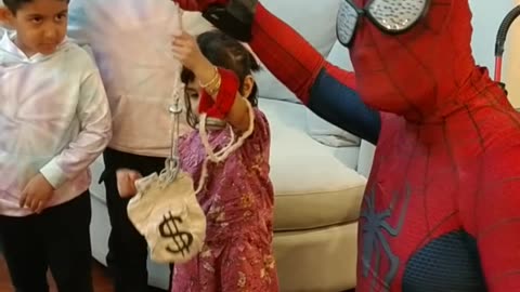 See this Spider hero superhero character teach this hero how to use a web line to get the money bag