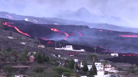 Lava streams past La Palma houses