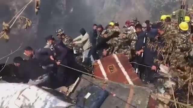 Nepal plane crash: Rescuers search through wreckage