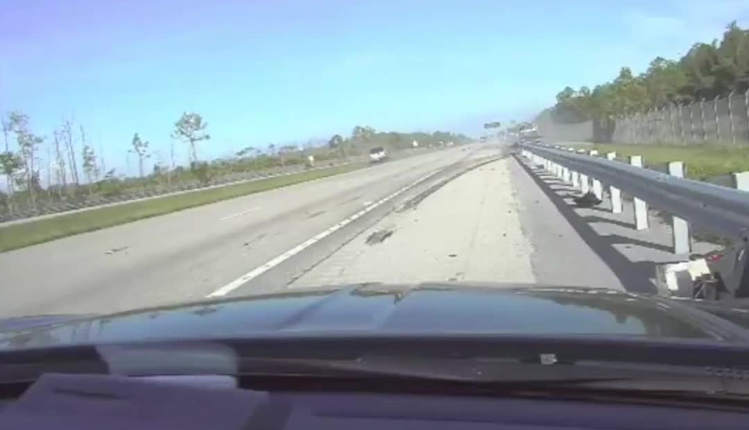 Dashcam captures scary moment when truck slams into patrol car