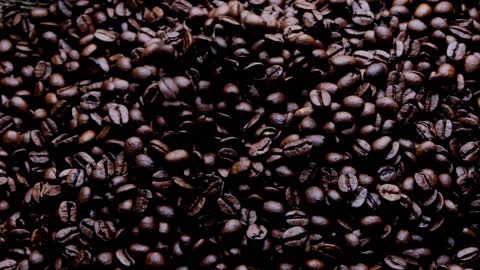 coffee beans and steam on dark background