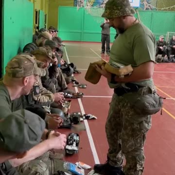 Ukrainian soldiers hang out in schools. One x US hat spotted.