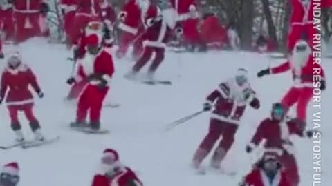 Over a hundred skiing and snowboarding Santas hit the slopes at U.S. charity event