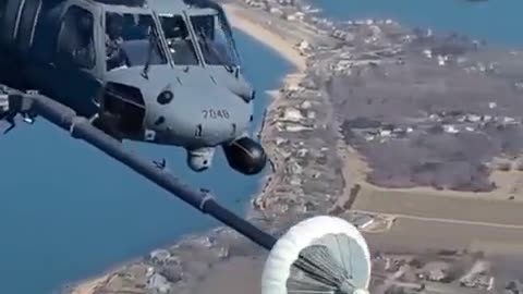 Helicopter refueling in mid air.