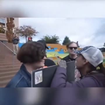 Trans protester tries to spit on feminist girl but she luckily bodies it