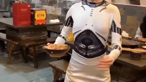 A Realistic Chinese Robot Waiter Enhances Dining Experience in a Chongqing Hotpot Restaurant