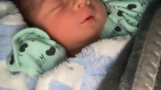 Only 12 hours old and talking to his sleep