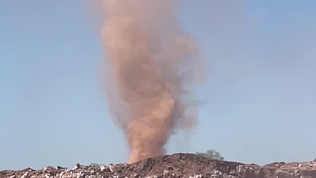 Dust Tornado Twists by a Quarry