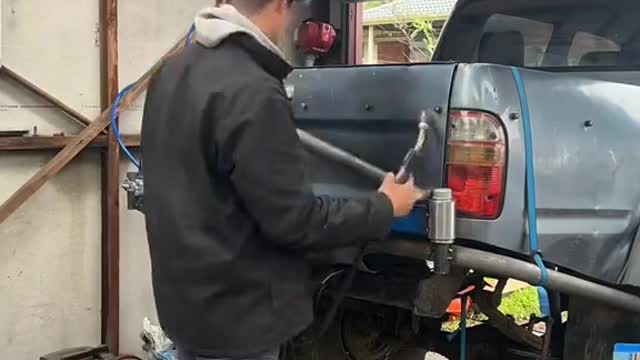 Retrofitting a truck spare tire storage rod.