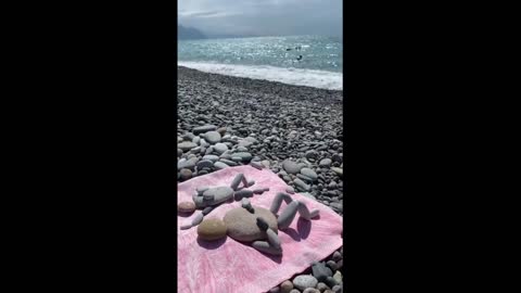 Perfectly placed beach rocks incredibly look like real people